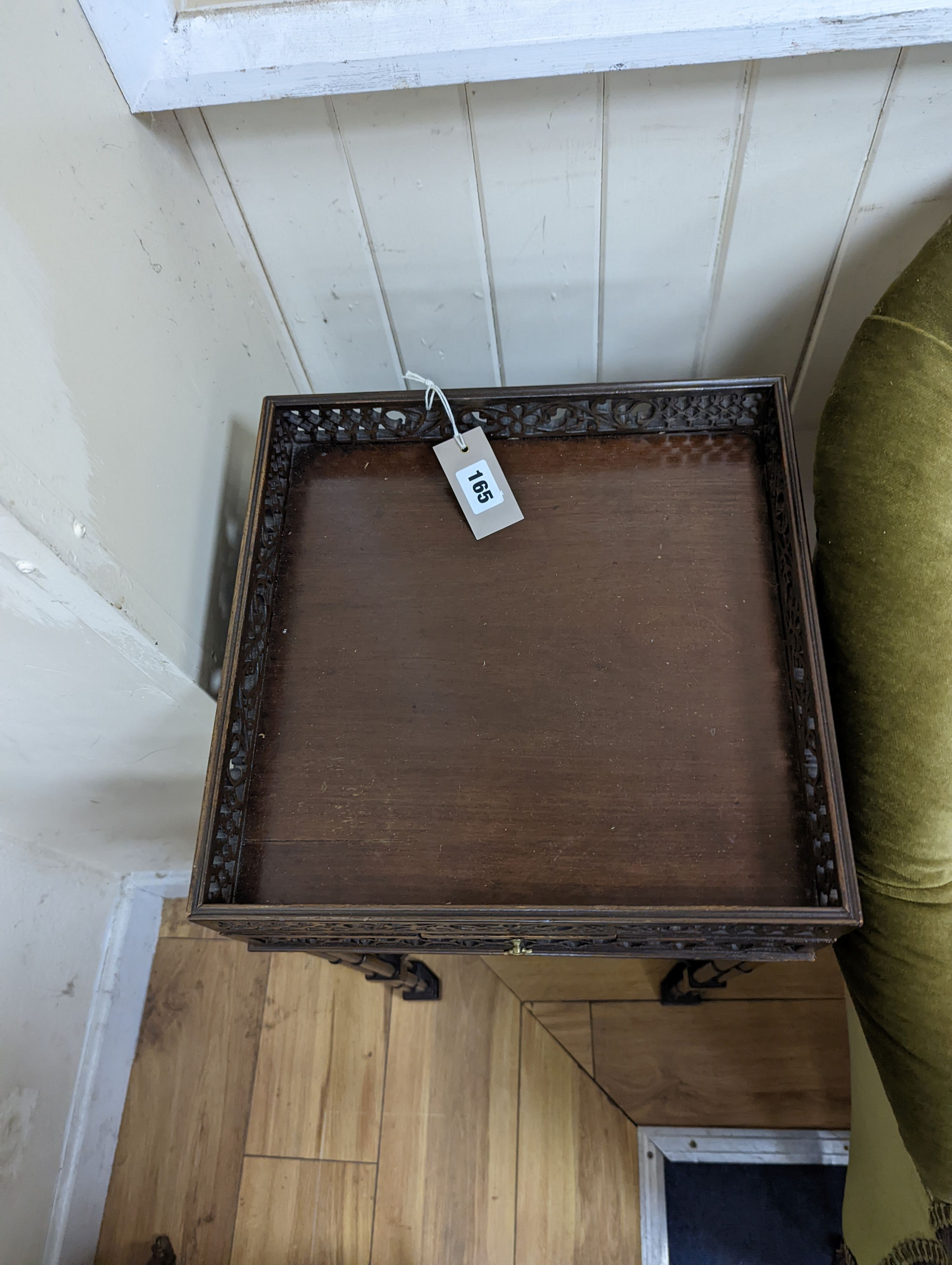 A pair of George III style square mahogany fret cut urn stands on cluster column legs, (one in need of repair) width 34cm, height 72cm